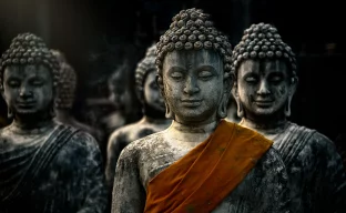 Buddha statue with ancient stupas in Buddhist temple